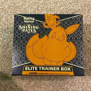 Pokémon Shining Fates ETB opened with cards and everything inside.